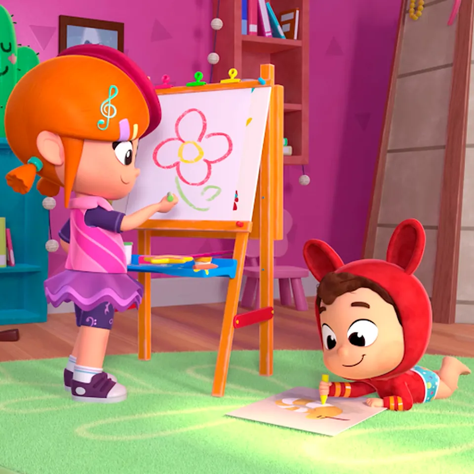 Lea painting a flower on an easel while Pop draws on the floor
