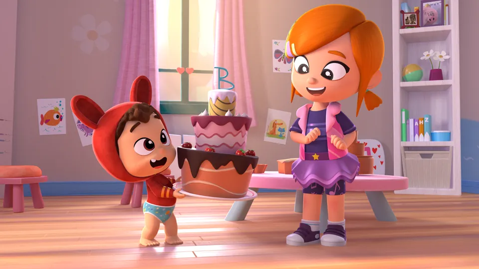 Lea and Pop with a giant birthday cake in their playroom
